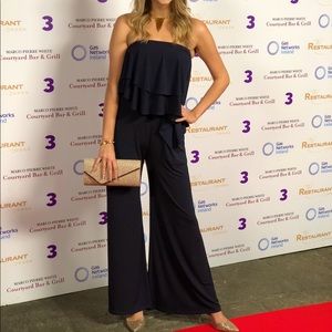 Royal blue sleeveless jumpsuit with wide leg and ruffle top